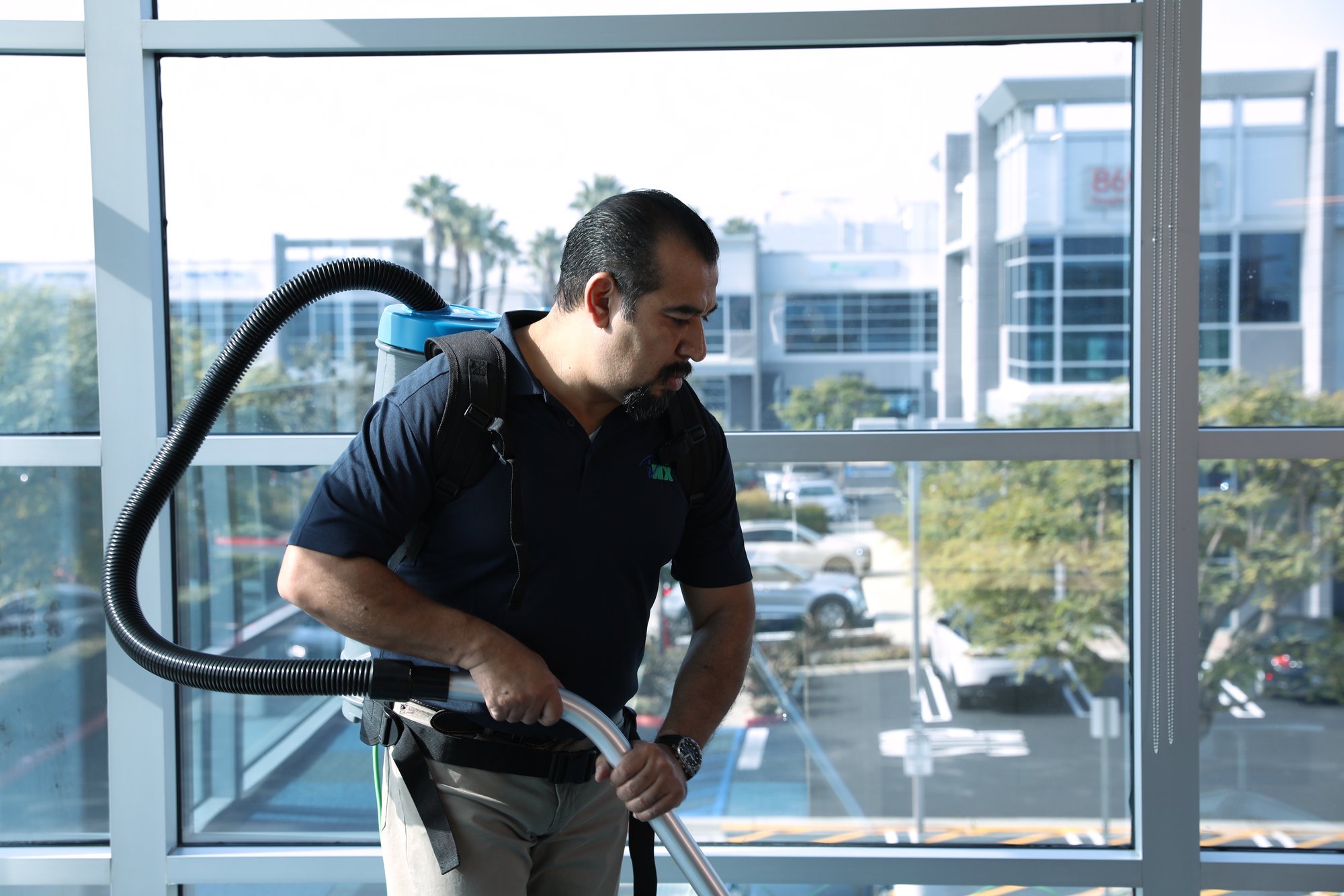 a commercial cleaner cleaning a hallway