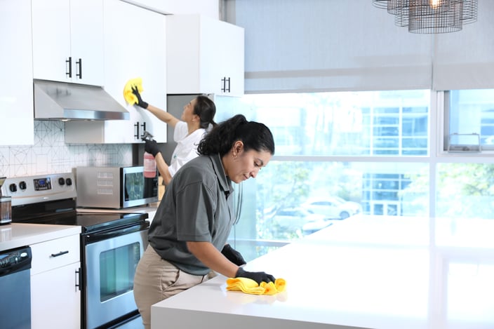 commercial cleaning team cleaning a company kitchen
