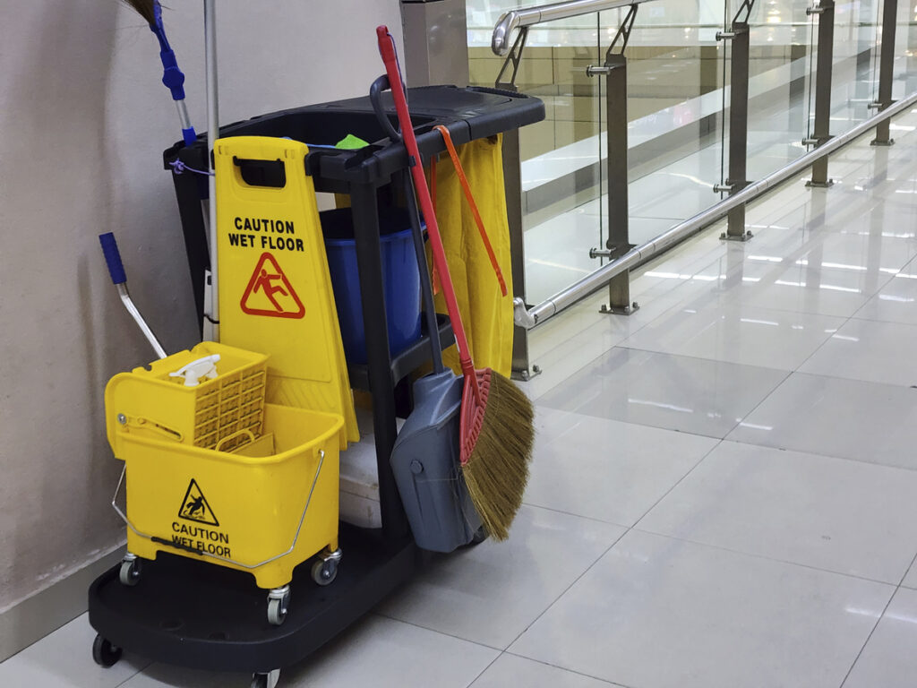 janitorial cleaning cart in a hallway